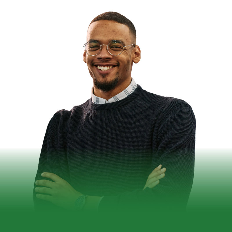 An employer smiling with their arms crossed.